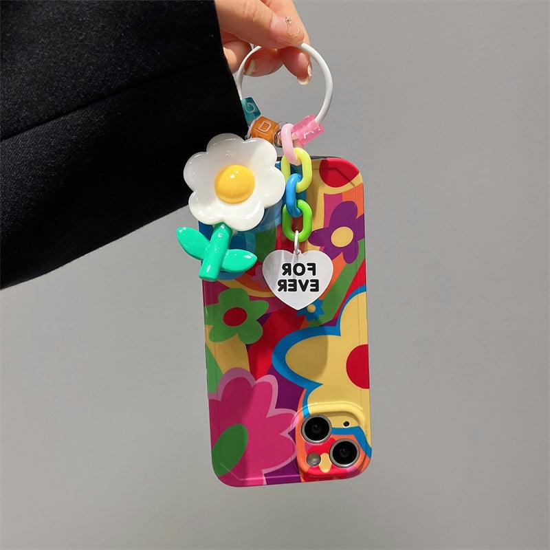 Coque iPhone 15 colorée avec motifs fleurs graffiti et porte-clés fleur blanche et jaune attached. - Wiqeo