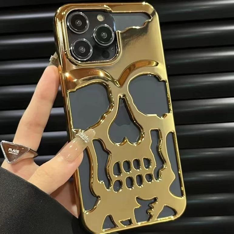Coque iPhone 15 Pro Max en acrylique doré avec design crâne en relief noir brillante. - Wiqeo