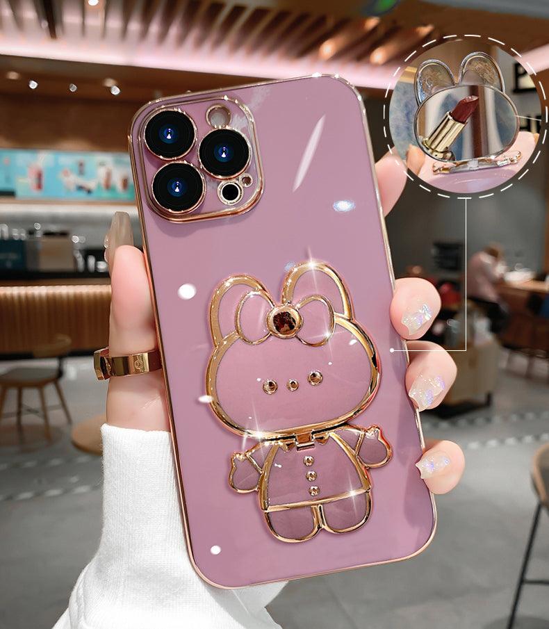 Coque rose pour iPhone 14 Plus avec design chat en relief doré brillant et support intégré avec miroir. - Wiqeo