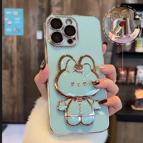 Coque iPhone 15 Plus bleu clair avec placage doré, support et miroir Hello Kitty intégré. - Wiqeo
