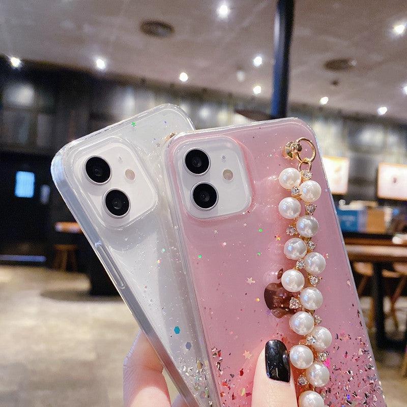 Coque rose scintillante pour iPhone 13 avec chaîne de perles blanches et dorées. - Wiqeo