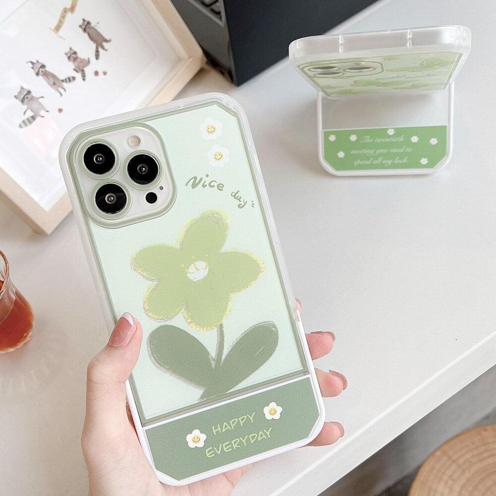 Coque transparente iPhone 13 Pro Max avec support latéral vert, fleur et texte "Nice day" et "Happy everyday". - Wiqeo